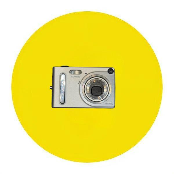 Compact digital camera with Hello Kitty design, featuring a pink and white color scheme and hearts pattern.