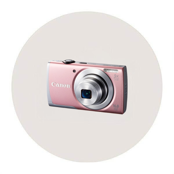 Compact digital camera with Hello Kitty design, featuring a pink and white color scheme and hearts pattern.