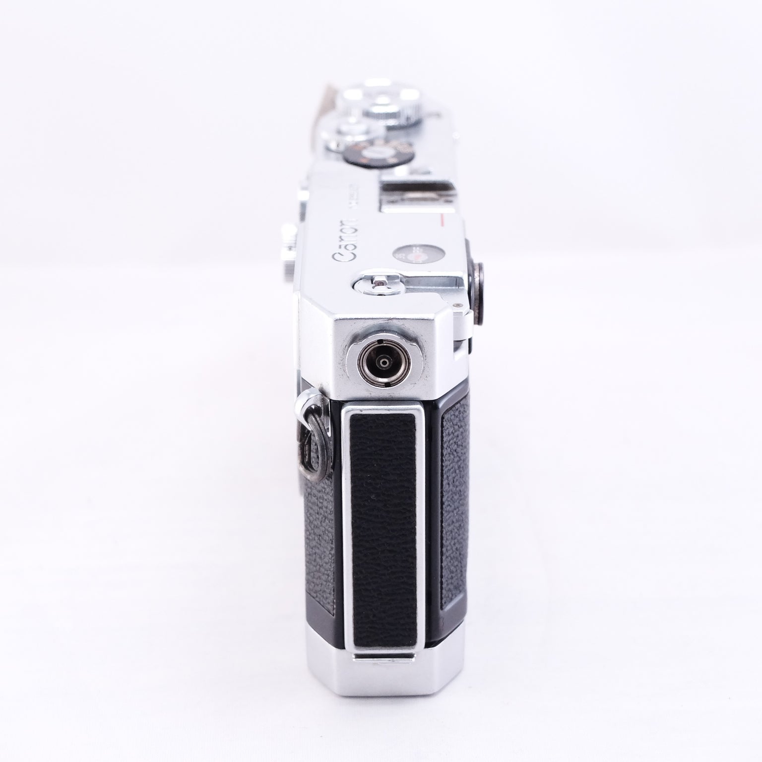 Canon VT deluxe film rangefinder camera, showcasing its sleek side profile and classic design.