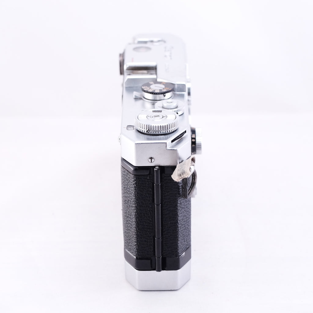 Side view of Canon VT Deluxe film camera showcasing its classic design and controls.