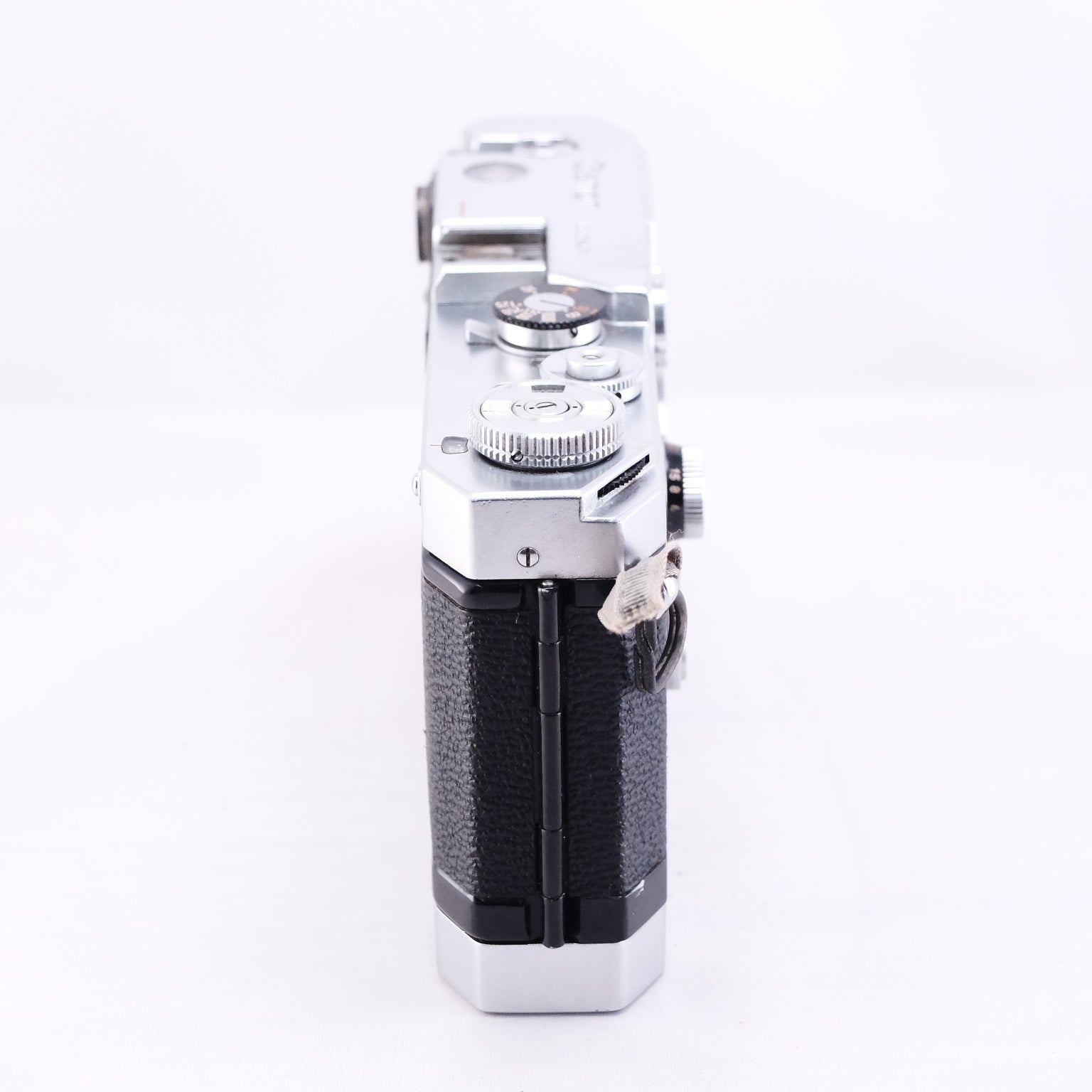 Side view of Canon VT Deluxe film camera showcasing its classic design and controls.
