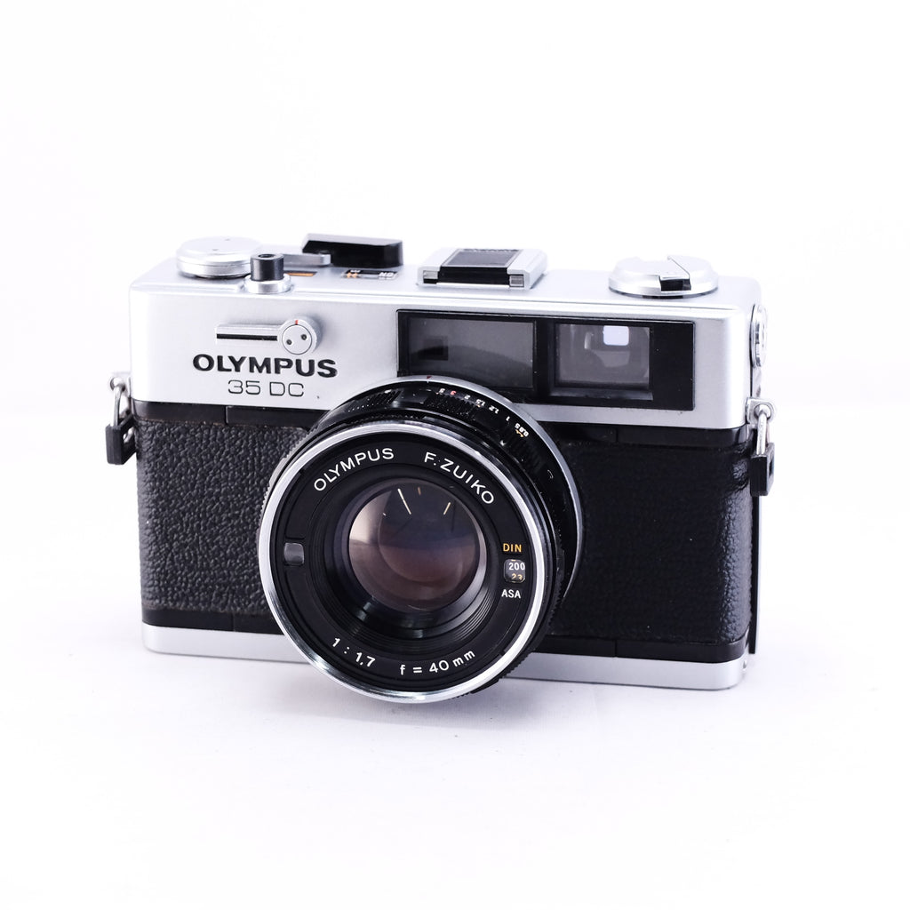 OLYMPUS 35DC film rangefinder camera with black leather body and lens, front view.