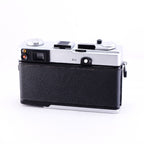 OLYMPUS 35DC film camera in black leather design from the back view with chrome accents.