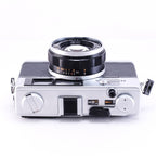 OLYMPUS 35DC film camera in black, top view with lens, vintage design and rangefinder features.